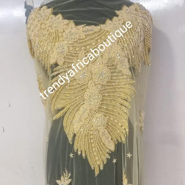 Back in stock Champagn/gold Heavily-beaded/crystal stones net George for making blouses. Popularly use by Igbo/Delta/edo women for big Occasions. Comes in 1.8yds lenght already design for your beautiful celebrant blouse