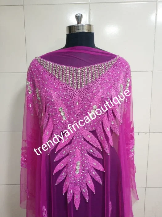 Fuschia pink Heavily-beaded net for making blouses. Popularly use by Igbo/Delta/edo women for big Occasions. Comes in 1.8yds lenght already design for your beautiful blouse