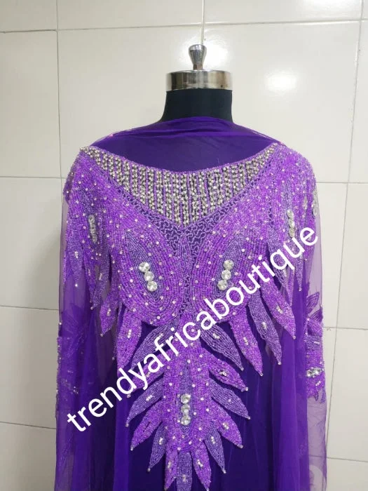 Purple Heavily-beaded net for making blouses. Popularly use by Igbo/Delta/edo women for making modern blouse for big Occasions. Comes in 1.8yds lenght already design for your beautiful blouse